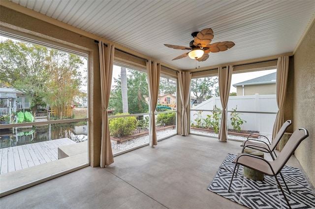 sunroom featuring a wealth of natural light and ceiling fan