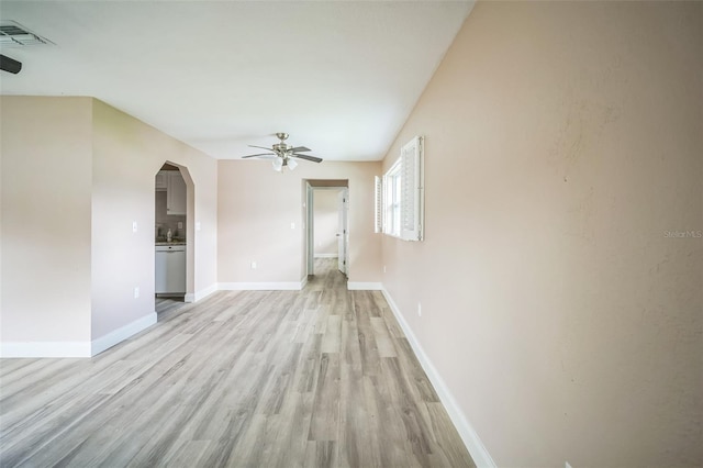 unfurnished living room featuring light hardwood / wood-style floors and ceiling fan