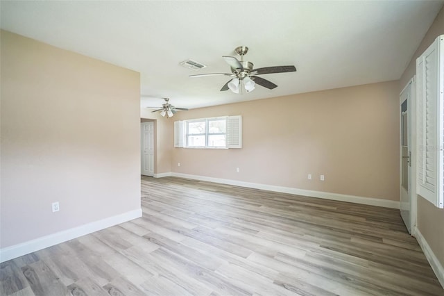 spare room featuring ceiling fan and light hardwood / wood-style flooring