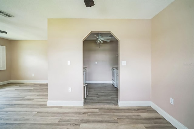 empty room with light hardwood / wood-style floors