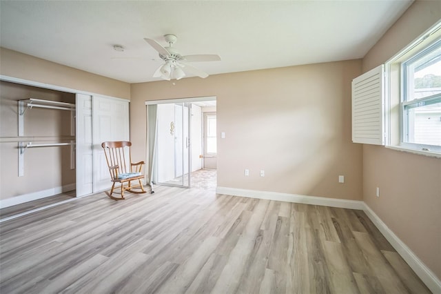 unfurnished bedroom featuring ceiling fan and light hardwood / wood-style floors