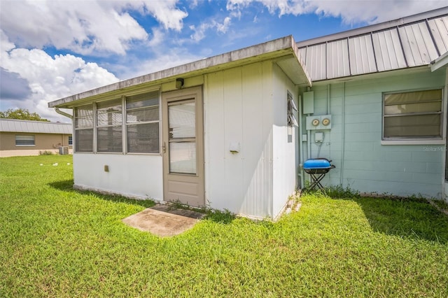 view of side of home featuring a yard