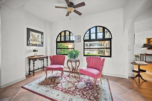 living area with ceiling fan