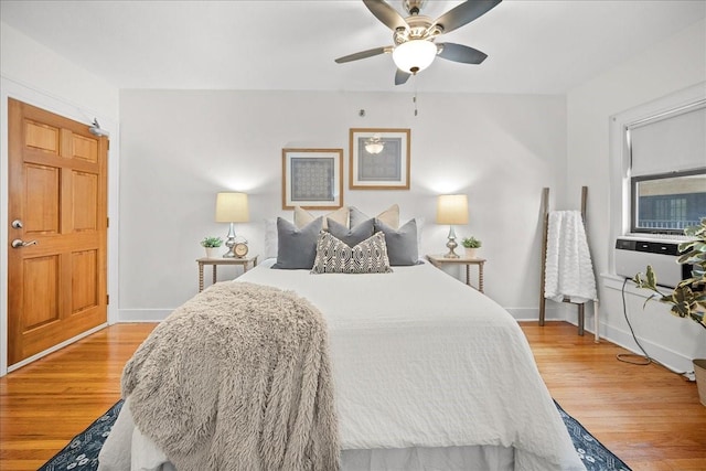 bedroom with hardwood / wood-style flooring and ceiling fan