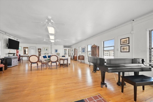 miscellaneous room with ceiling fan and light hardwood / wood-style flooring