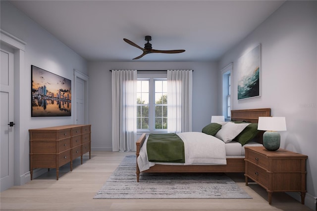 bedroom featuring light hardwood / wood-style floors and ceiling fan