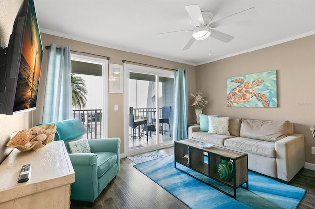 living room featuring dark hardwood / wood-style floors, ceiling fan, and ornamental molding