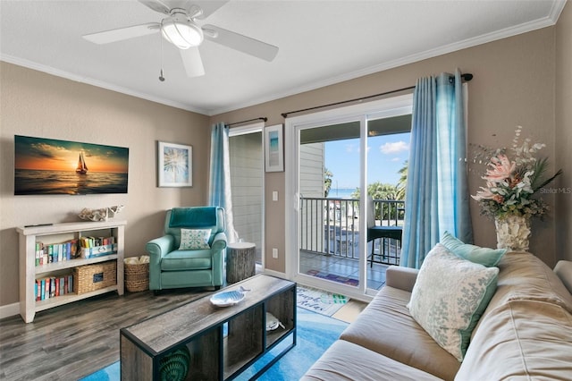 living room with ceiling fan, ornamental molding, and hardwood / wood-style flooring