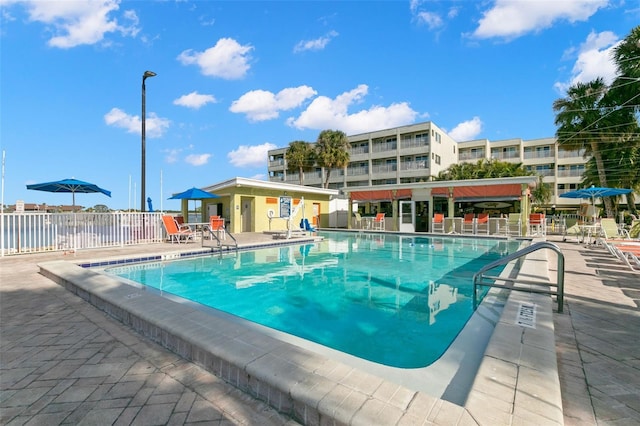 view of swimming pool featuring a patio