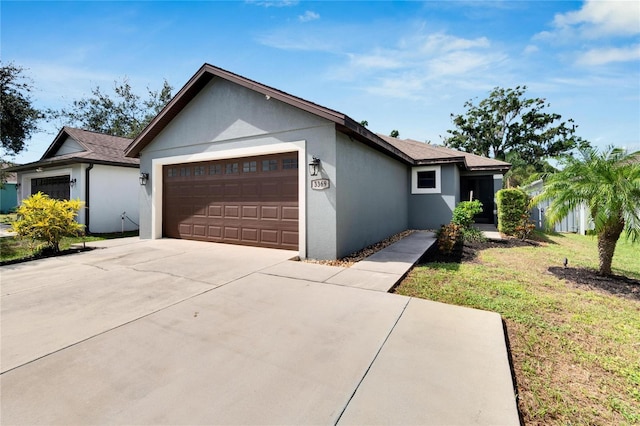 single story home with a garage and a front yard