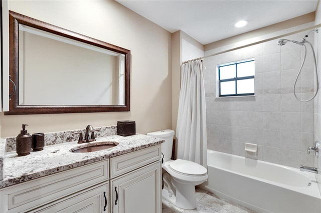 full bathroom with vanity, toilet, and shower / tub combo