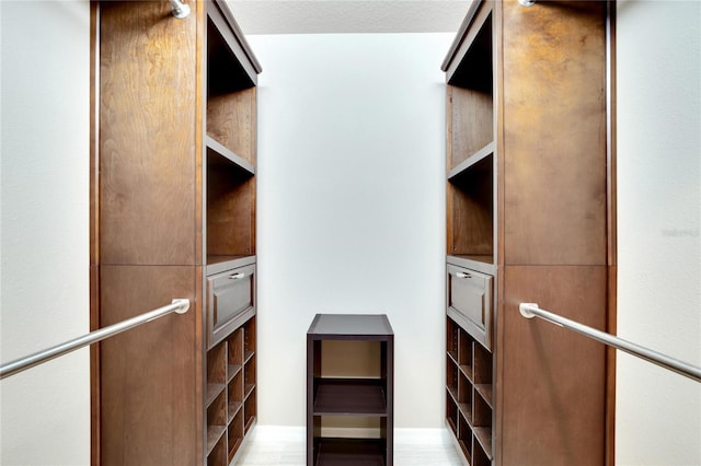 walk in closet featuring light hardwood / wood-style flooring