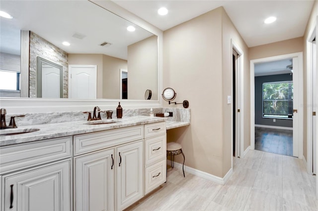 bathroom with hardwood / wood-style flooring and vanity