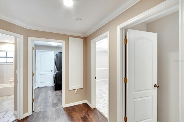 hall with ornamental molding and dark hardwood / wood-style floors