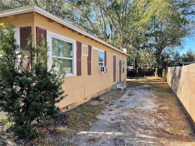 view of side of home with cooling unit