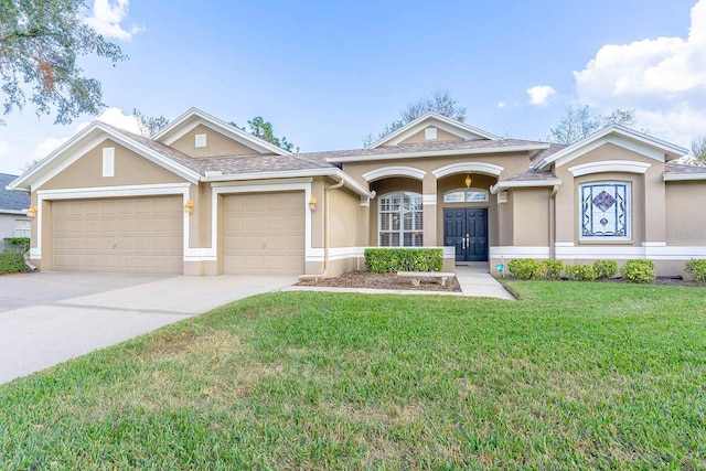 ranch-style house with a front yard and a garage