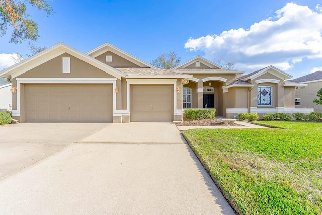 view of front facade featuring a front yard and a garage