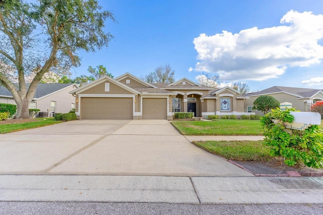 ranch-style house featuring central AC, a front yard, and a garage