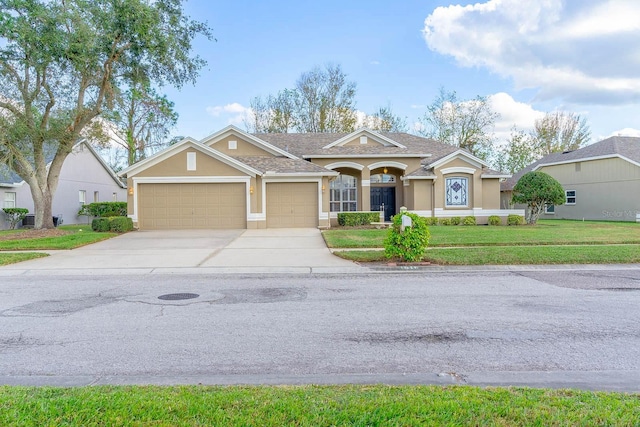 ranch-style house with a front lawn and a garage