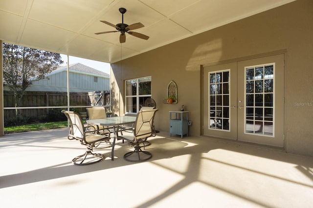 view of patio / terrace featuring ceiling fan and french doors