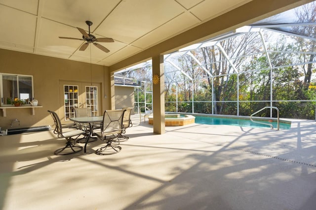 view of pool featuring an in ground hot tub, a patio, french doors, a lanai, and ceiling fan