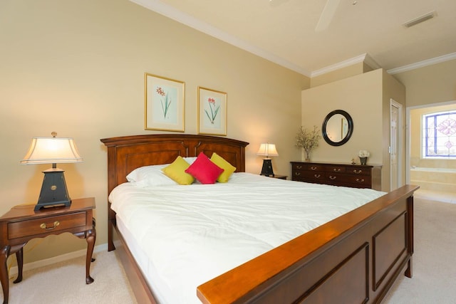 bedroom with ensuite bathroom, light carpet, ceiling fan, and ornamental molding