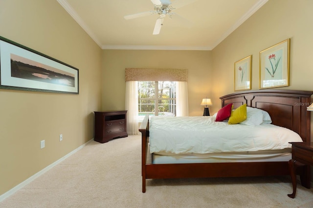 carpeted bedroom featuring ceiling fan and crown molding