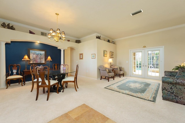 carpeted dining space with ornate columns, french doors, a notable chandelier, and crown molding