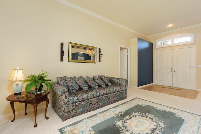 entrance foyer featuring carpet floors and ornamental molding