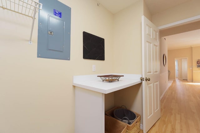 interior space featuring electric panel and hardwood / wood-style flooring