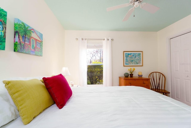 bedroom with ceiling fan and a closet