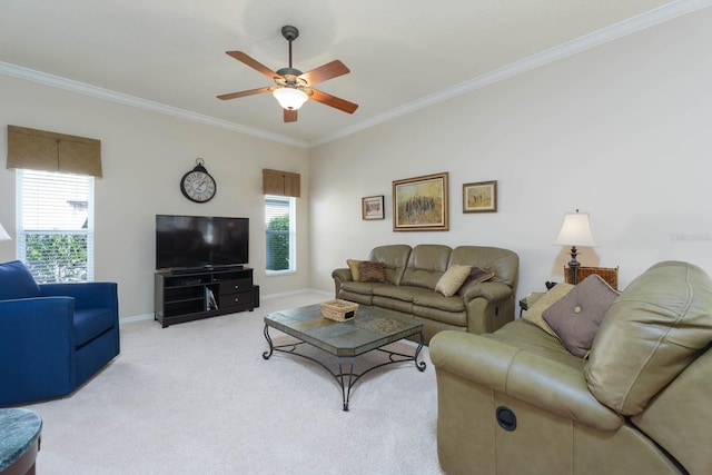 carpeted living room with ceiling fan, a wealth of natural light, and ornamental molding