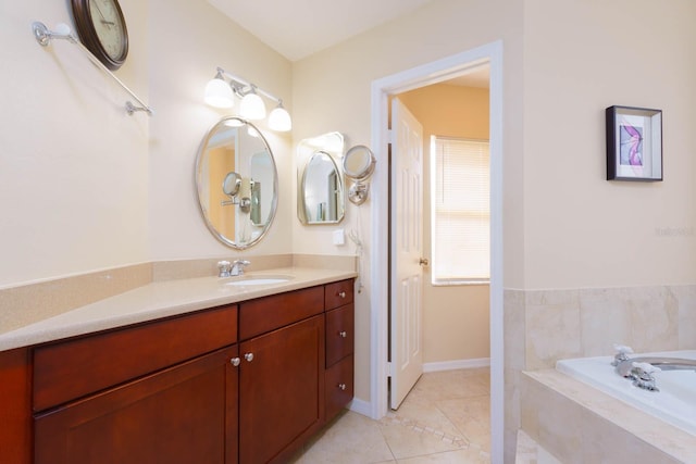 bathroom with vanity, tile patterned flooring, and tiled bath