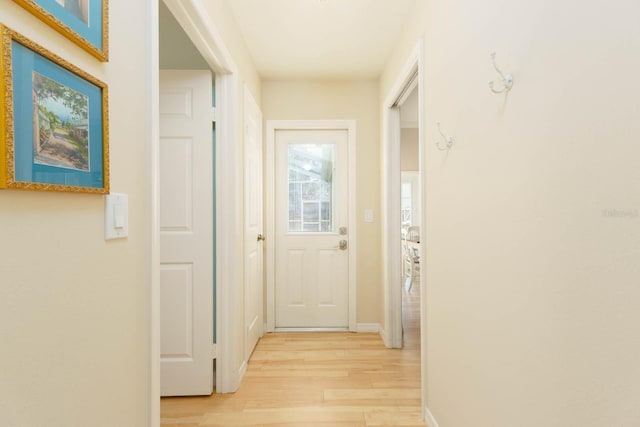 hallway with light wood-type flooring