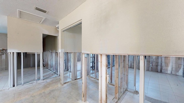 interior space with a textured ceiling