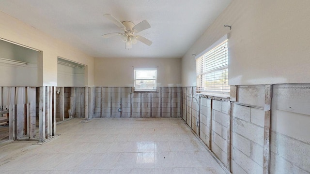 unfurnished room featuring ceiling fan