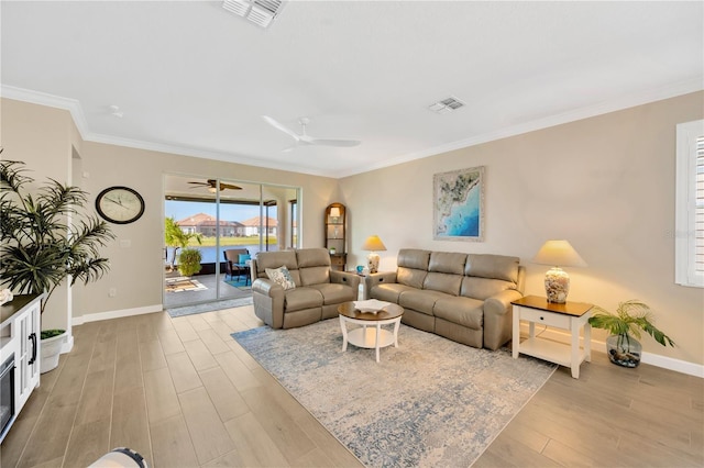 living room featuring crown molding and light hardwood / wood-style floors