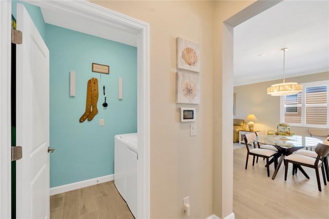 corridor featuring light hardwood / wood-style floors