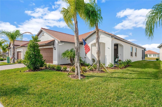 mediterranean / spanish-style home featuring a front lawn and a garage