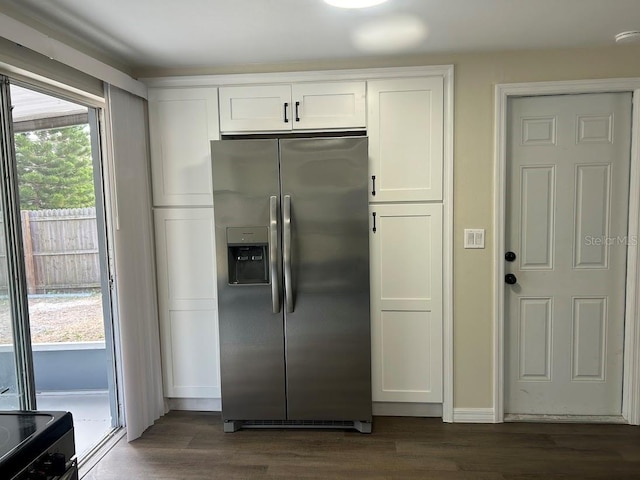 kitchen with white cabinets, stainless steel refrigerator with ice dispenser, and dark hardwood / wood-style floors