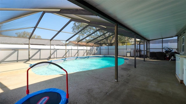 view of pool with a lanai and a patio