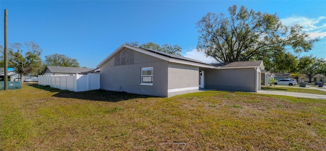 view of property exterior with a lawn