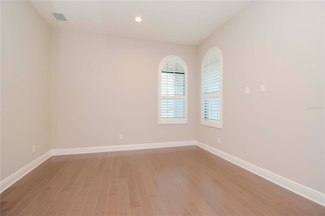 unfurnished room featuring wood-type flooring