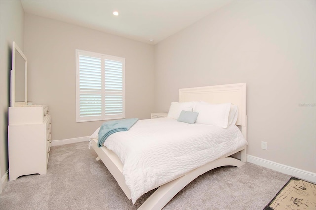 bedroom with light colored carpet