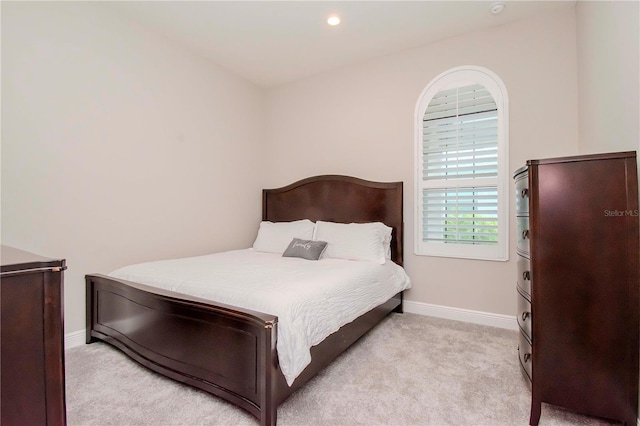 bedroom with light colored carpet