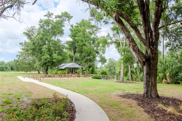 view of home's community with a gazebo and a yard