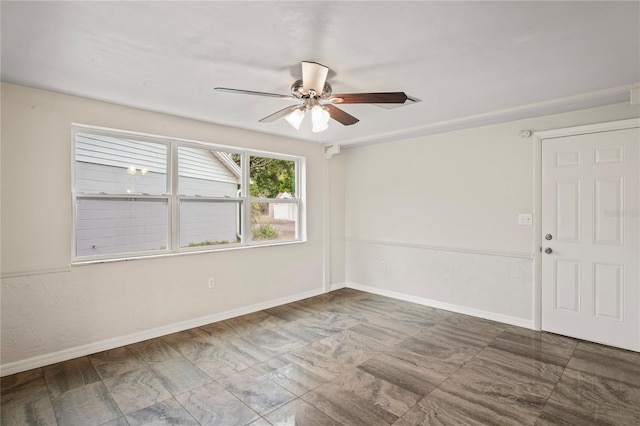 empty room featuring ceiling fan