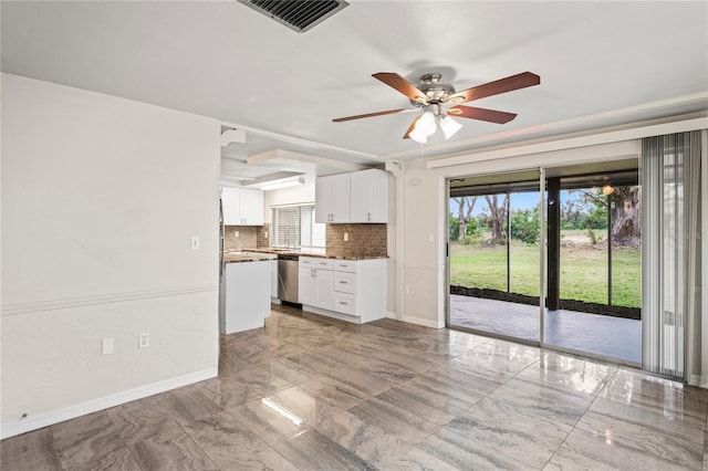 kitchen with white cabinetry, backsplash, plenty of natural light, and dishwasher