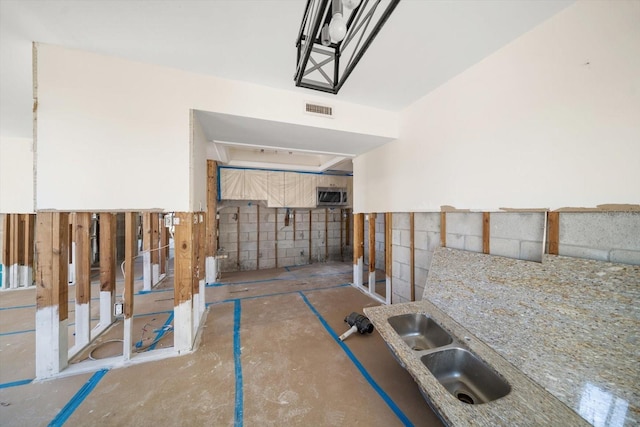 interior space with sink and a wall mounted air conditioner