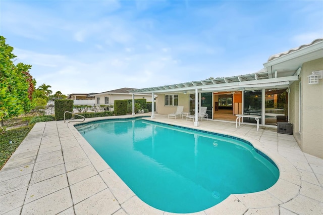 view of swimming pool featuring a patio area